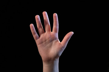 hand isolated on black background