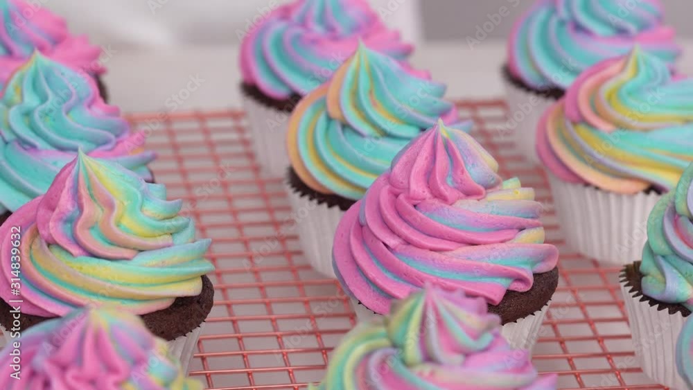 Poster Step by step. Frosting unicorn chocolate cupcakes with rainbow color buttercream frosting.