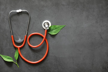 Background medical concept. Cardiologist's table. A stethoscope and medicine are prescribed by a...