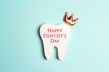 Happy Dentist's Day concept with tooth in the crown.