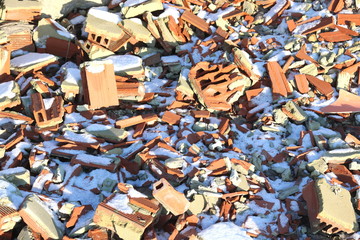 Construction waste with elements of various dismantled and destroyed old structures at municipal landfill