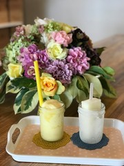 Ice cream and flowers in a vase on wooden table/ishigaki/japan