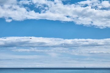 Obraz premium Minimal Seascape with Cloud Layers and Calm Horizon
