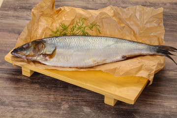 Salted herring over the wooden board