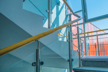 Stainless steel, glass and wood railing.Fall Protection. modern design of handrail and staircase