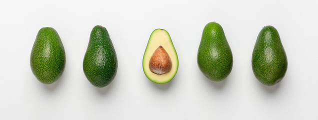 Collage of avocados with seeds on white background