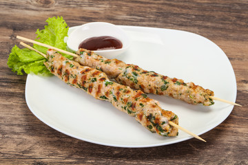 Minced pork skewer kebab with sauce