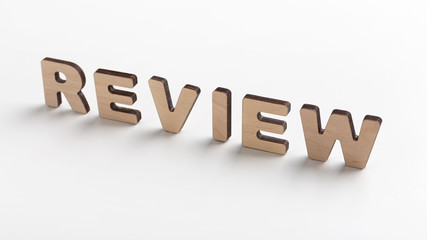 Word review of wooden letters on white background