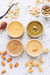 Nuts and seeds butter in glass jars