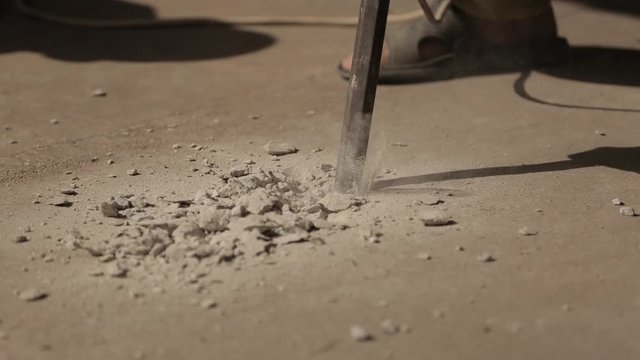 Professional electric tools. Work of a jackhammer. Close Up
