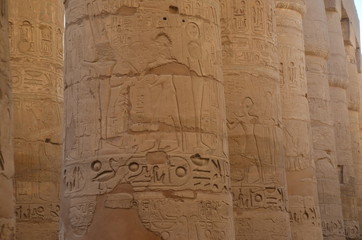 Ancient Egyptian murals and writings on the stone walls of the Karnak Temple in Luxor