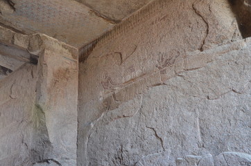 Ancient Egyptian murals and writings on the stone walls of the Karnak Temple in Luxor