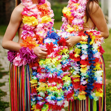 Aloha girls in hawaiian costume with flowers