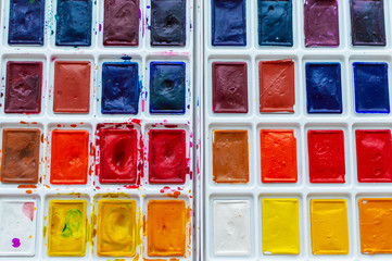 watercolor paints on a white background. Art workshop, art school.