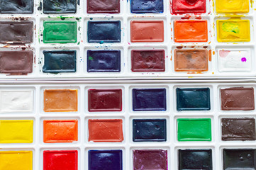 watercolor paints on a white background. Art workshop, art school.
