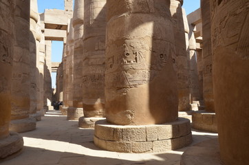 Tourist visiting the Great Hypostyle Hall.Karnak is an ancient Egyptian temple precinct located on...