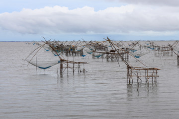 Fototapeta na wymiar Fish Lift Nets for catch the fish in lake, Thailand