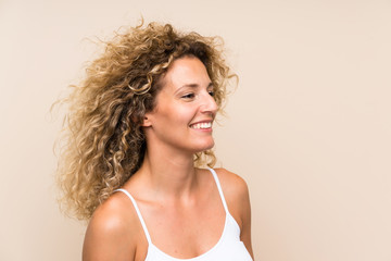 Young blonde woman with curly hair