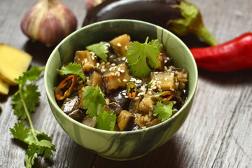 Fried eggplant with garlic, cilantro in ginger and soy sauce