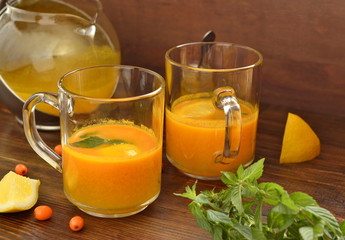 Sea buckthorn tea with lemon, honey and mint