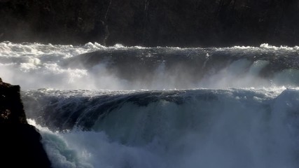 cascades in front of a waterfall in schaffhausen Switzerland