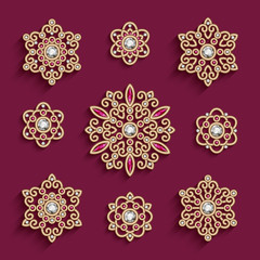 Elegant set of jewelry gold circle ornaments decorated with diamonds and ruby gem stones, vintage collection of round mandala patterns, top view of filigree jewellery pendant decoration