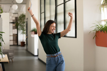 Emotional student girl celebrating successful exam pass