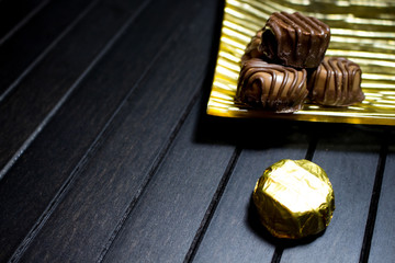 Various of sweet confectionery with chocolate candies and pralines. Handmade chocolates. Realistic chocolate set, delicious dessert pattern.