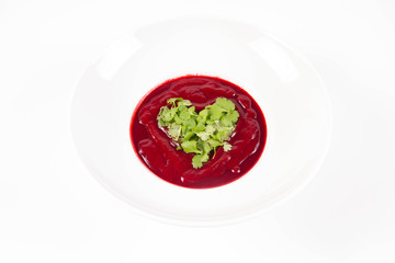Beetroot cream soup with a heart made of coriander - a romantic treat
