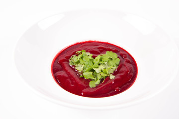 Beetroot cream soup with a heart made of coriander - a romantic treat