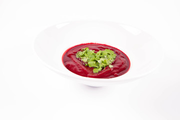 Beetroot cream soup with a heart made of coriander - a romantic treat