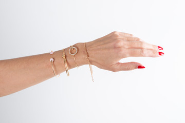 Detail of many several bracelet on woman Hand arm Model - obrazy, fototapety, plakaty