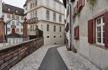 Empty Alley Amidst Buildings In City