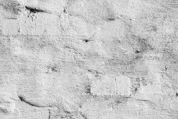 Texture of a concrete wall with cracks and scratches which can be used as a background