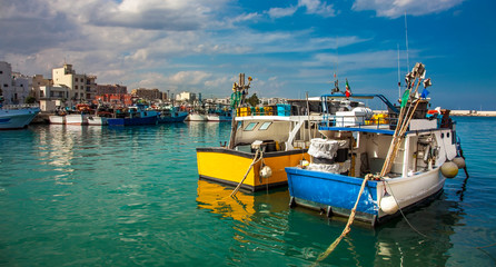 Fishing boats at the old port of Porto Vecchio in Monopoli Puglia Italy