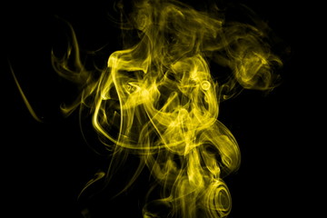 Yellow smoke on black background