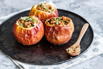 Baked apples with nut granola and pumpkin seeds.