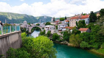 Fototapeta na wymiar Panoramic view of the historic town of Mostar with famous Old Bridge (Stari Most), a UNESCO World Heritage Site since 2005, Bosnia and Herzegovina.