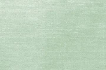 Fototapeta premium Close-up handmade natural cotton, linen old fabric textile cloth in light white green turquoise vintage retro color for abstract background