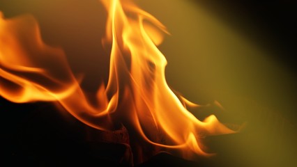 Fire, flames on a black background isolate. Concept fire grill heat weekend barbecue, Flame heat fire abstract background black background. Dangerous concept 