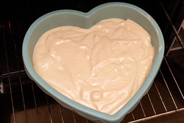 Heart shape cake cooking process. Valentines day gift preparation dating.