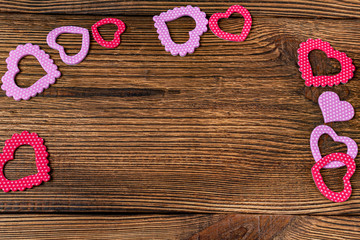 Present gift card with hearts and flowers for Valentine day on the wooden background