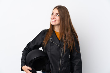 Fototapeta premium Woman with a motorcycle helmet laughing and looking up