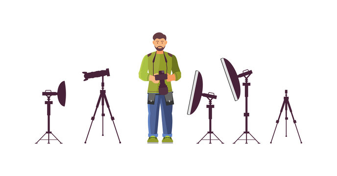 Professional photographer with professional equipment camera with optional accessories, lighting equipment in studio. Male photographer character preparing for photo shoot cartoon vector illustration