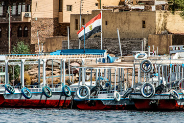 Marina Philae EGYPT Egyptian flag on Tourists boats to Philea temple UNESCO moved temple because of...