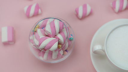 Pink marshmallows with a delicious hot drink. Little girl's Breakfast.