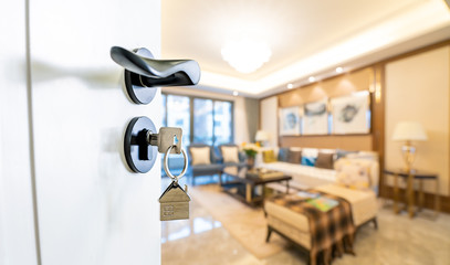 Open door with keys, key in keyhole