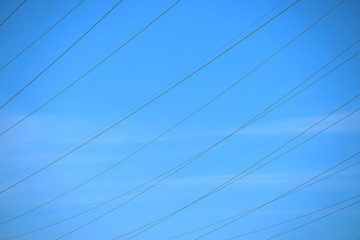 Electric lines on sky background.