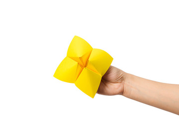 Hand in a paper fortune teller isolated on white background.