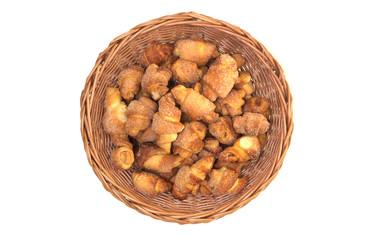 Wicker basket with homemade cookie rolls. Sweet bakery with jam filling. Top view.